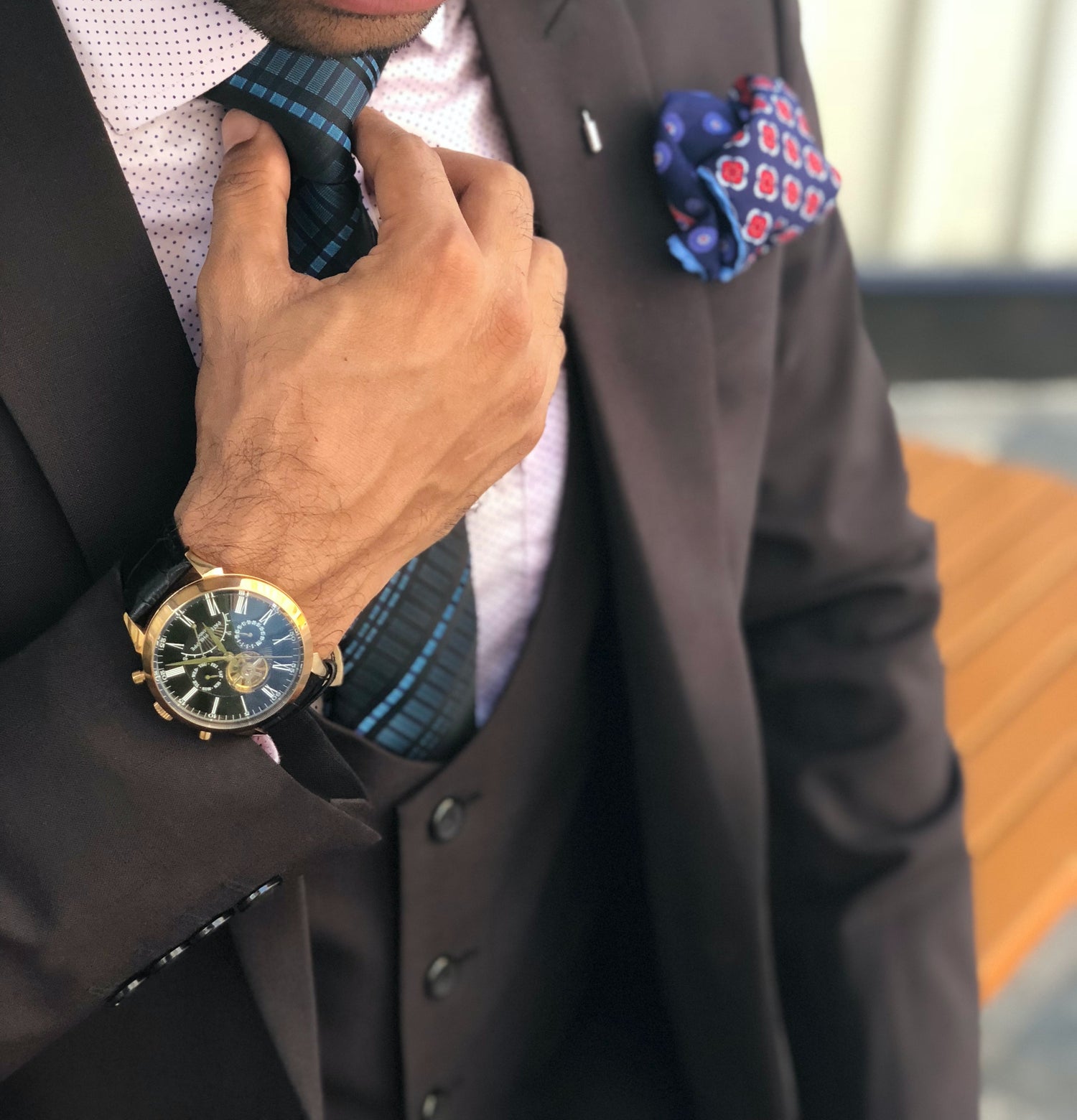 Why is there a row of buttons on the cuffs of a suit?